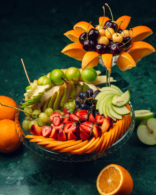 decorated-fruit-plate-with-sliced-fruits_